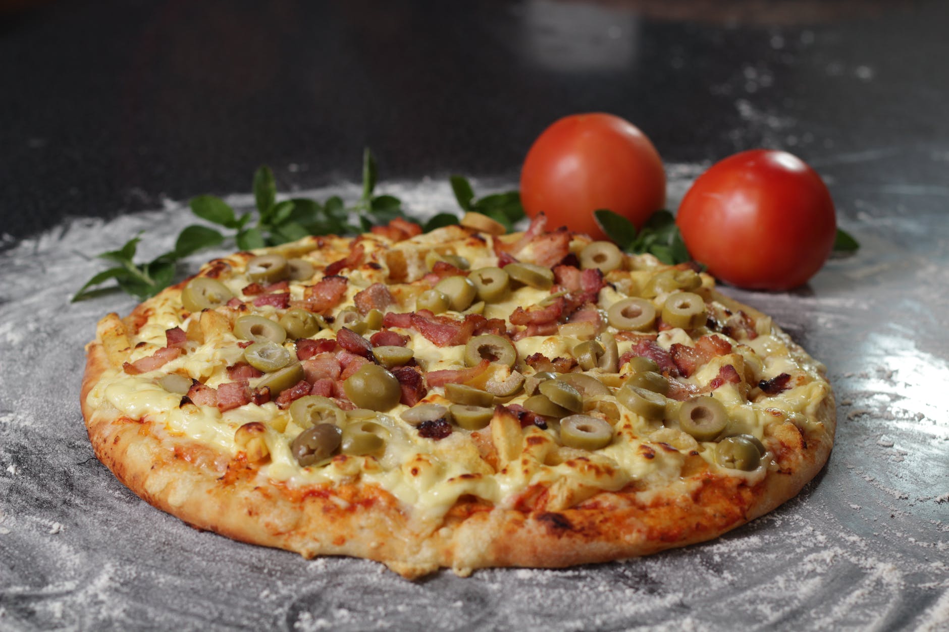 photography of pizza with olive toppings